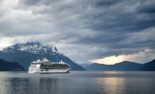 white and gray cruise ship on body of water in Lote Norway