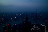 Evening view of a city skyline highlighting prime real estate locations.