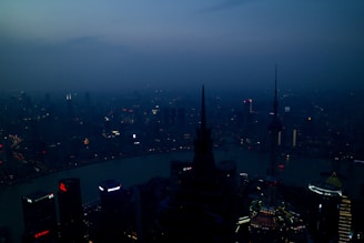 Evening view of a city skyline highlighting prime real estate locations.