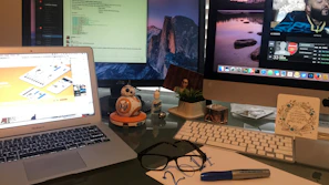 Organized desk setup showcasing multiple screens with different tool demonstrations open