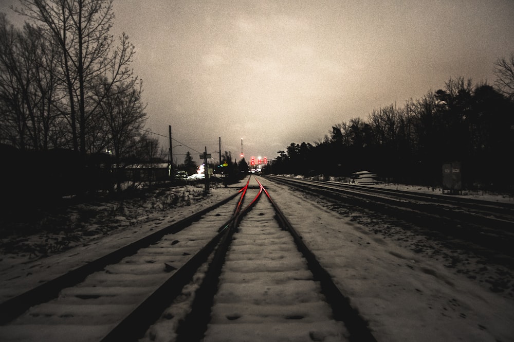 black train railway covered with snow