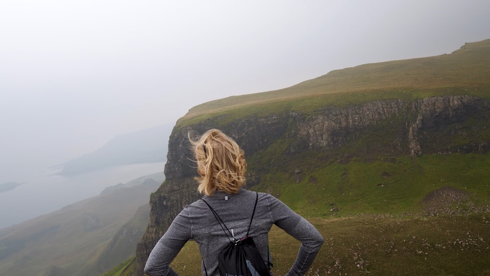 woman standing near cliff