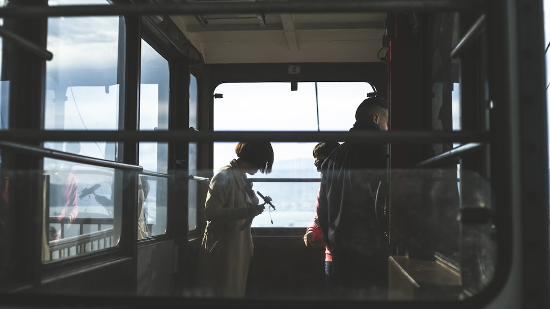 woman and man inside cable car, Commuters on a train