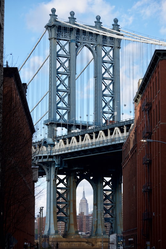 gray and white metal bridge photo in Brooklyn Bridge Park United States