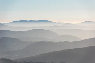 mountains cover by fogs