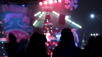 A festive scene with colorful lights glowing above the dance floor.