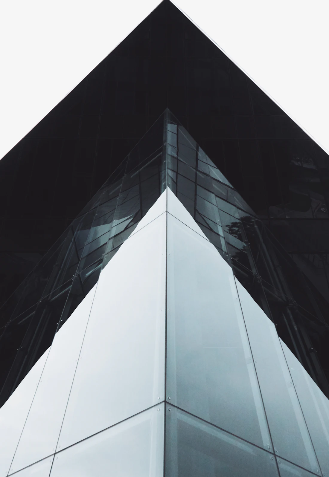 Dark glass commercial tower photographed from street level