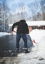 Snow being carefully removed from a driveway in Chesterfield during winter.