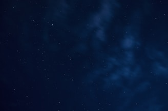 A serene night sky with deep blue and golden stars reflecting the minimalistic European style.