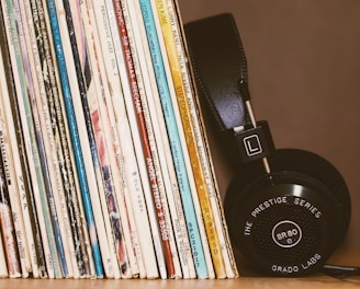 wireless headphones leaning on books