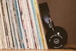 Stylish music accessories including headphones and vinyl cleaners.