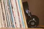 Stylish music accessories including headphones and vinyl cleaners.