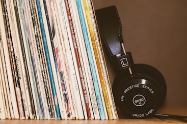 wireless headphones leaning on books