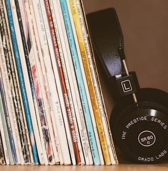 wireless headphones leaning on books