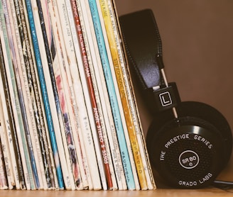 wireless headphones leaning on books