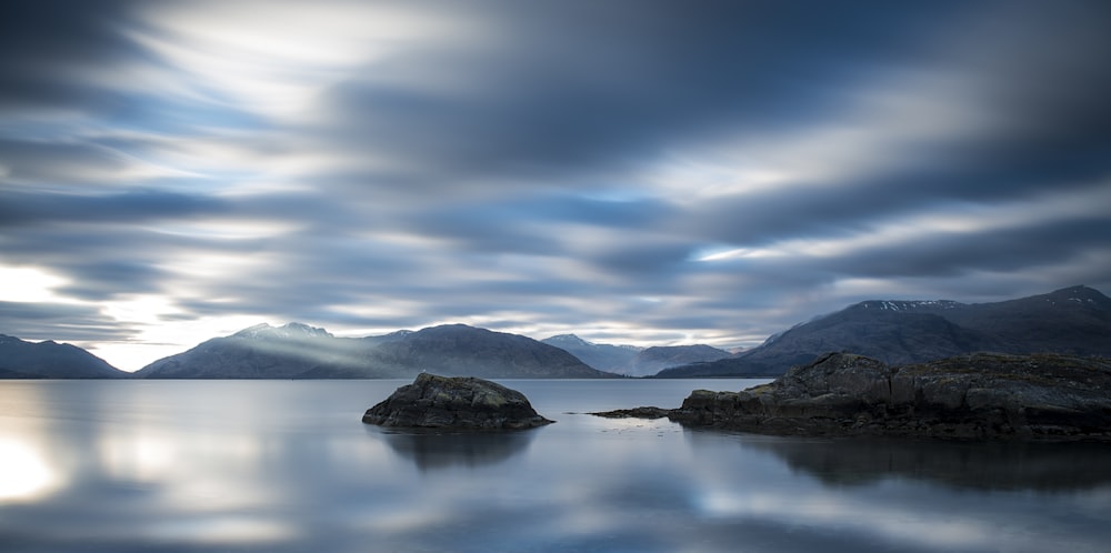 body of water near mountain