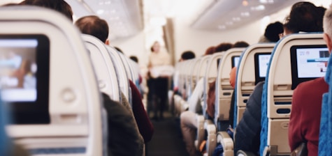 shallow focus photography of people inside of passenger plane