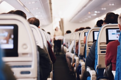 shallow focus photography of people inside of passenger plane