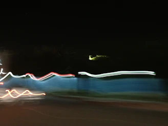 Softly blurred light trails weaving through a dark, serene background, evoking fleeting memories.