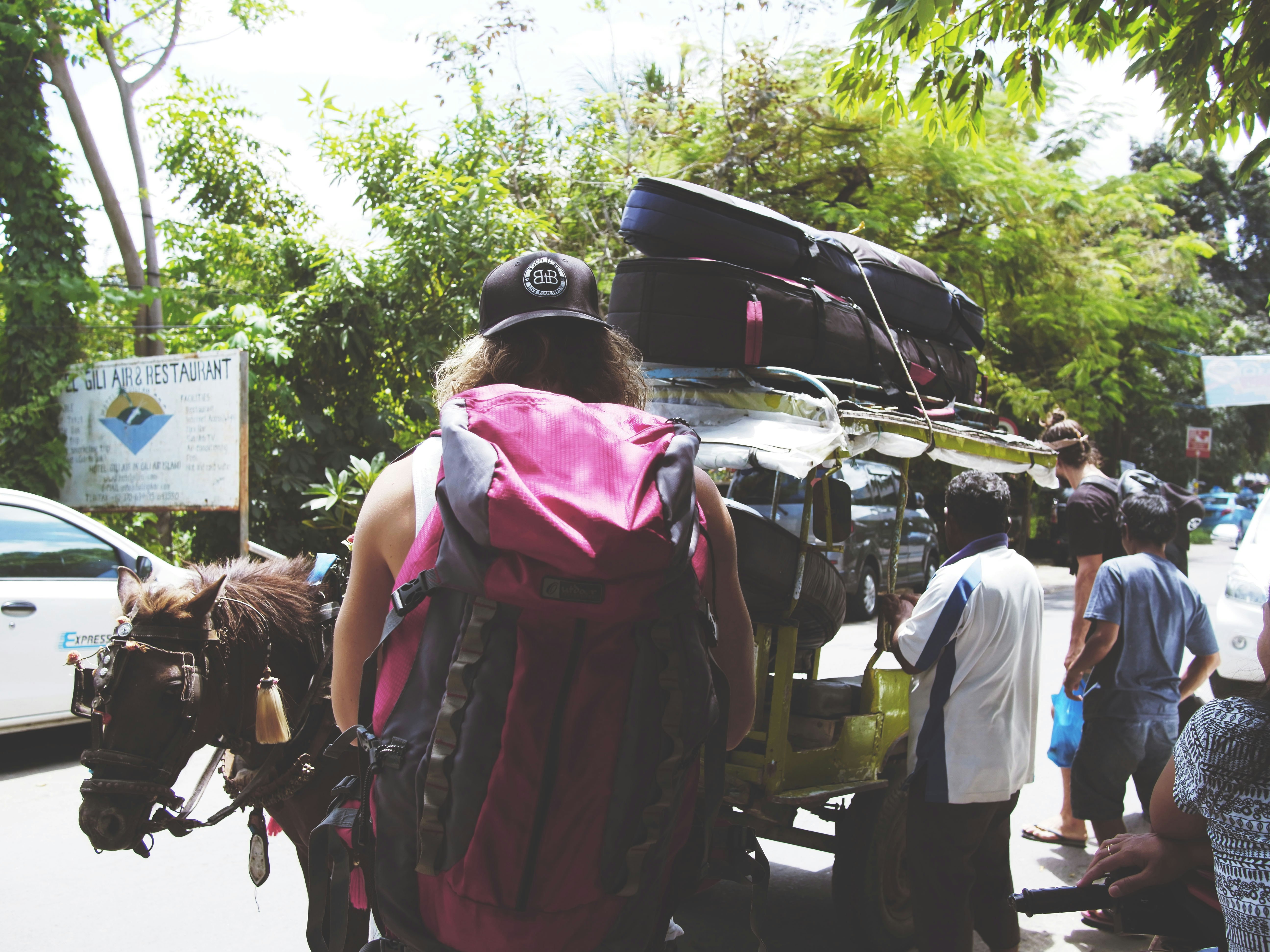 men standing beside cart