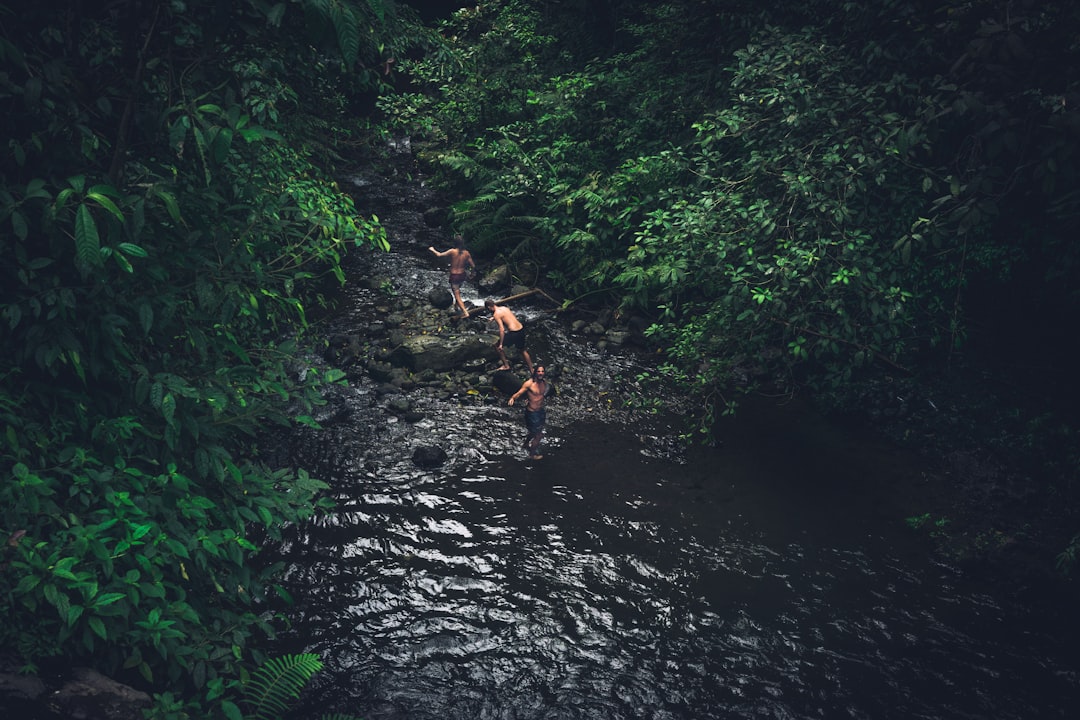 Men adventuring in river