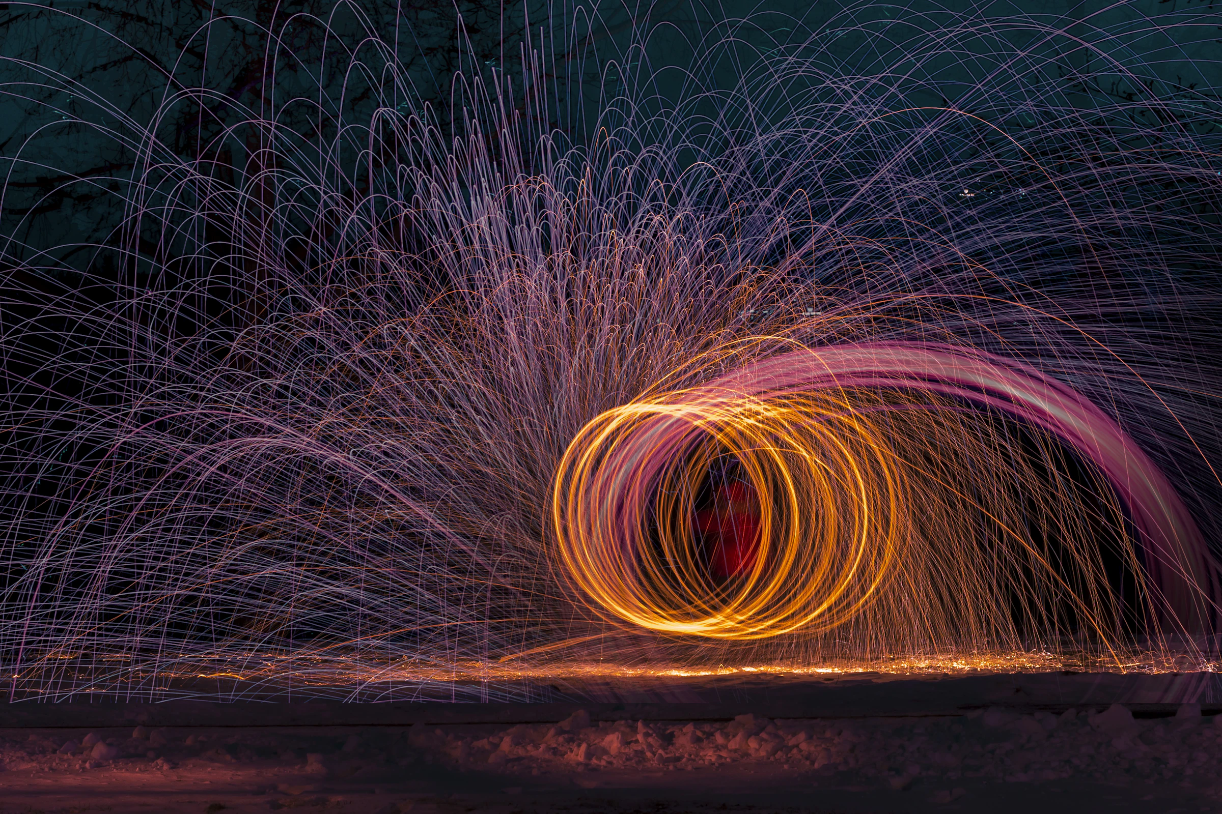 A ring of pink and orange light drawn with a long exposure