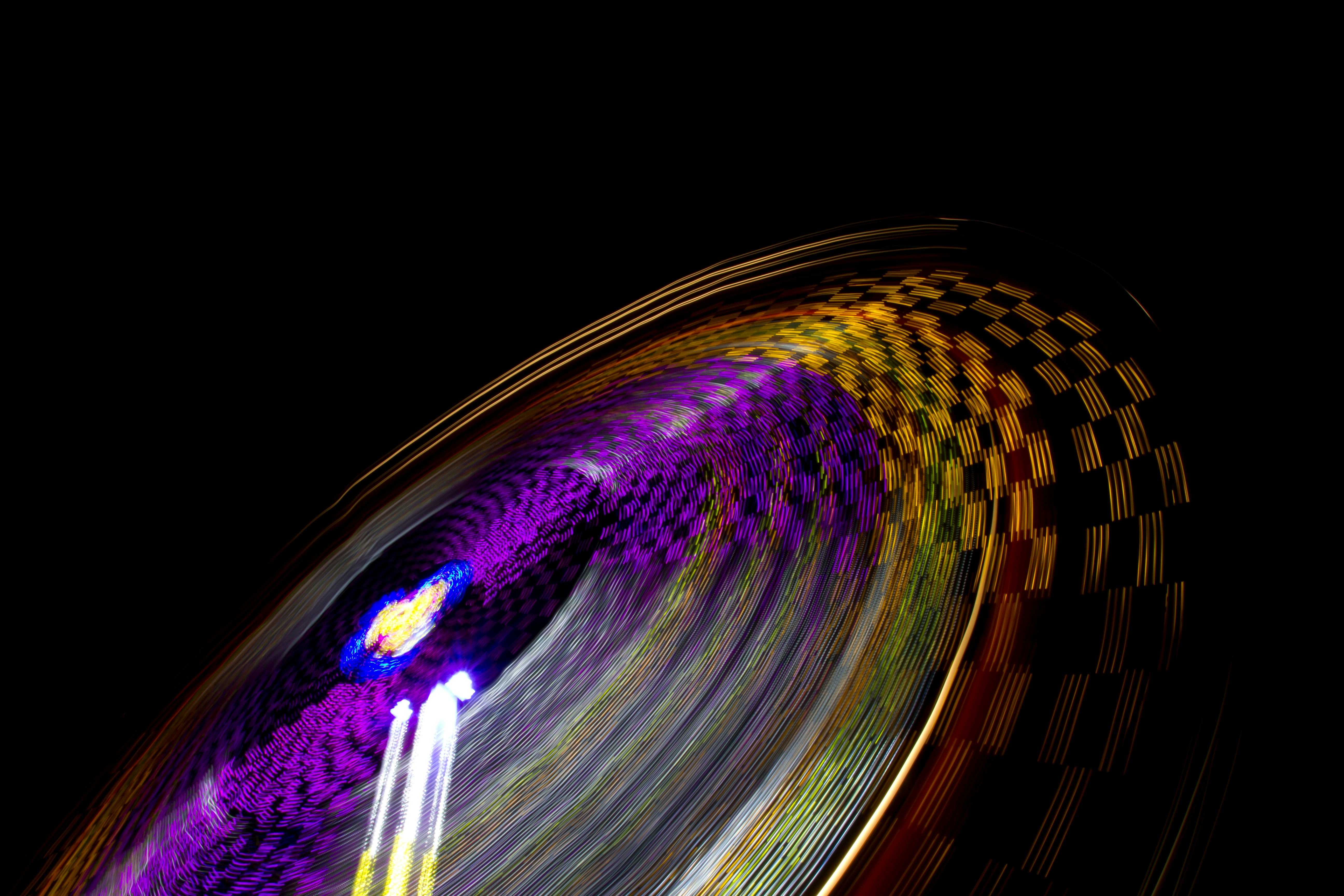 time lapse photography of multicolored amusement ride
