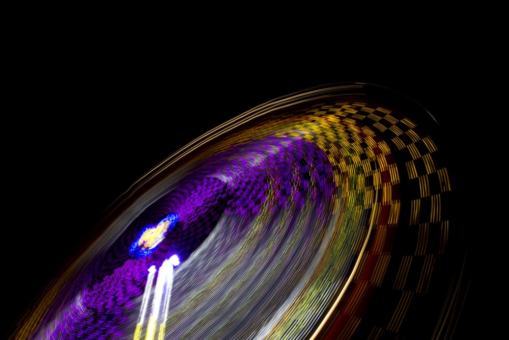 time lapse photography of multicolored amusement ride