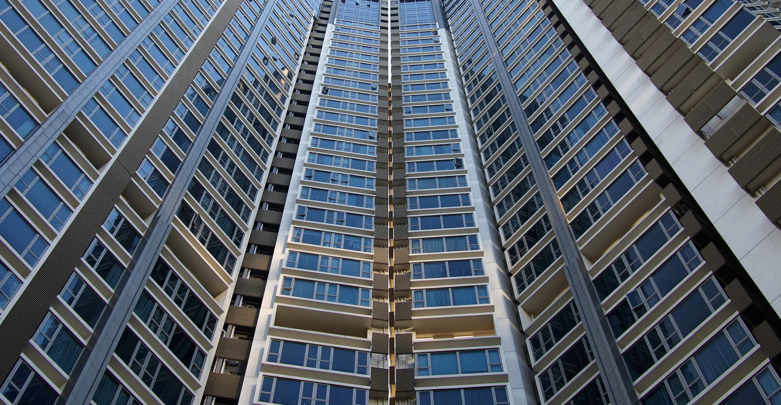 Blue and grey office towers seen from below