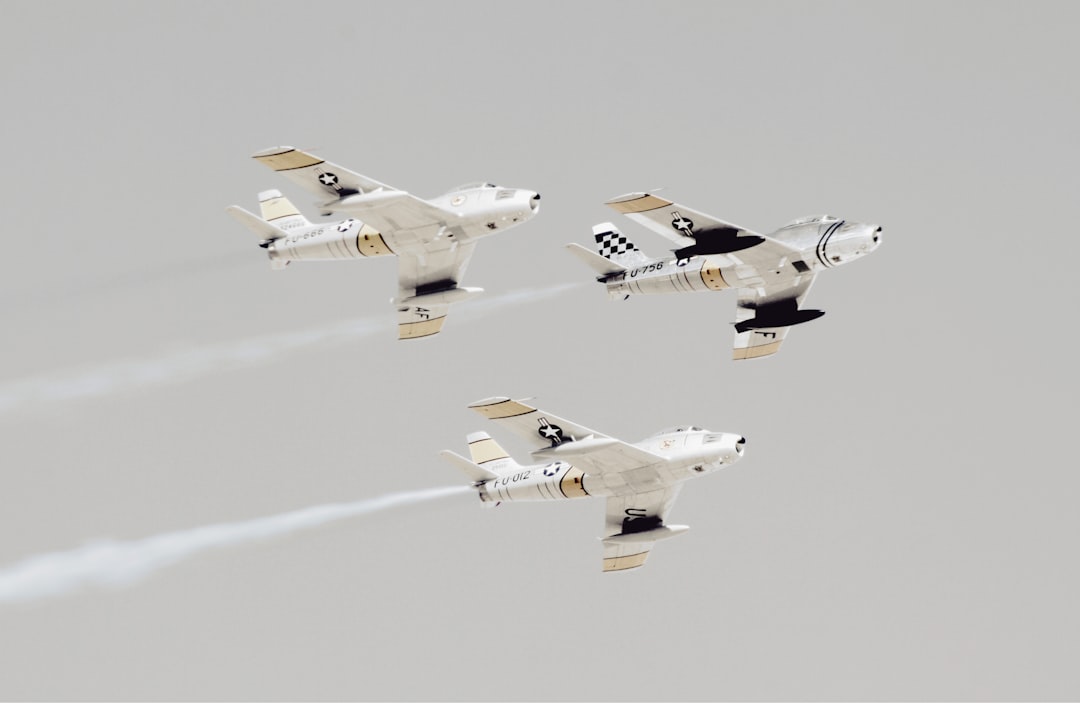 three white-and-black jet planes