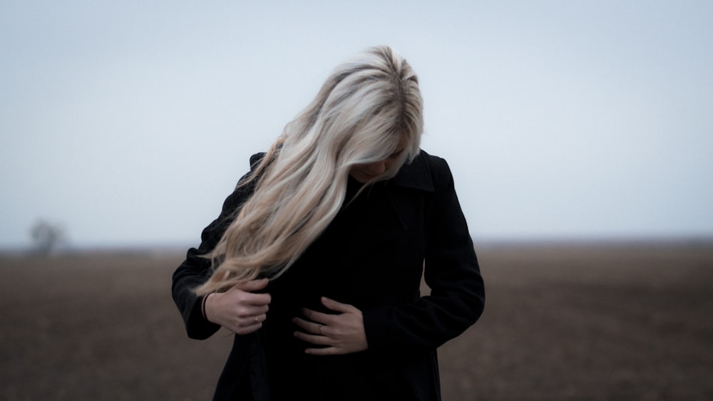 woman wearing black coat