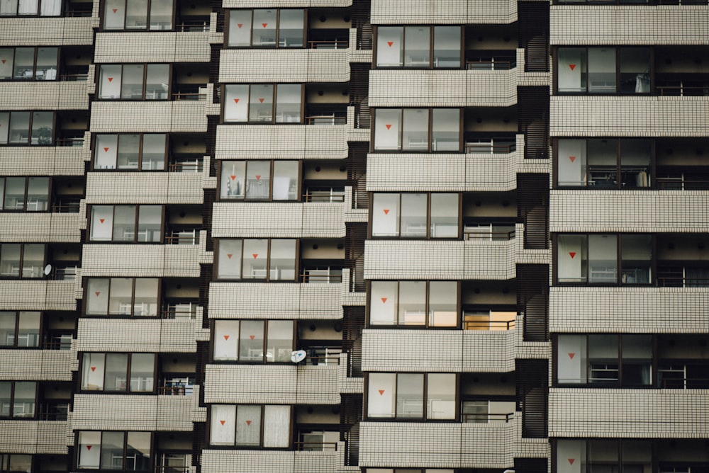 photo of white condo unit during daytime