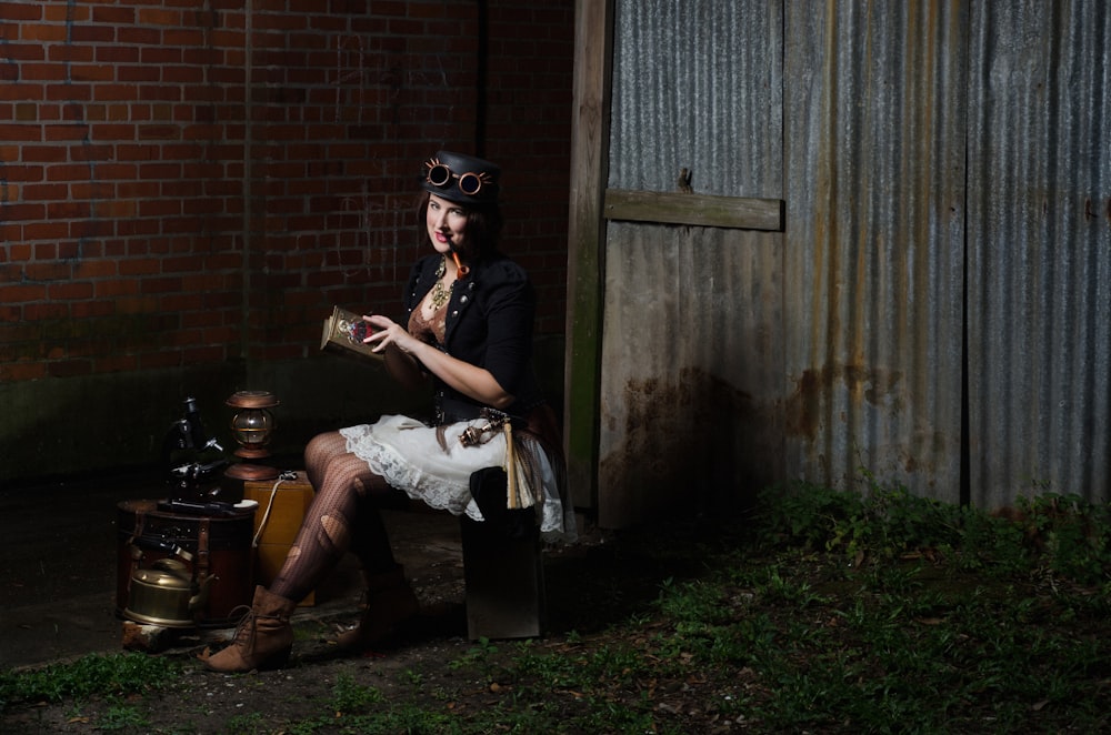 woman sitting on barrel