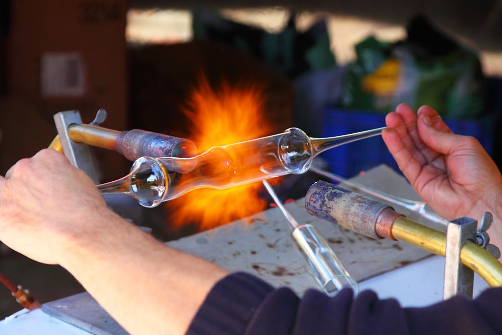 person holding and testing test tube