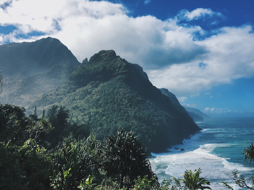 landscape photography of mountain near sea