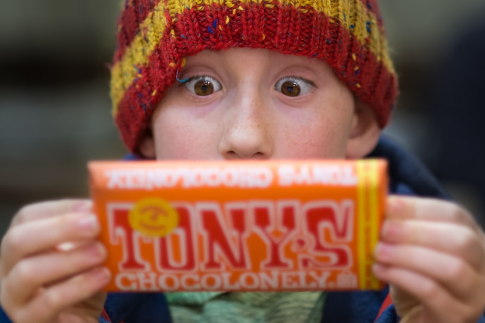 boy holding Tony's chocoloney pack