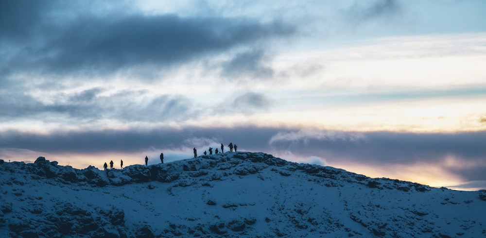 silhouette of people on mountain