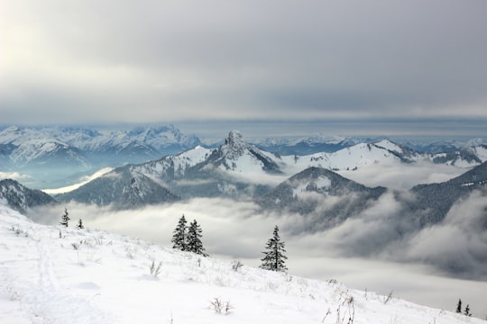 snow covered mountains under grey clouds in Wallberg Germany