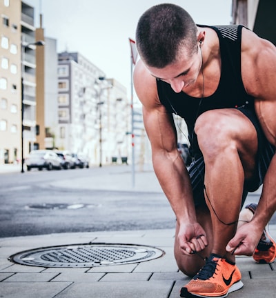 man tying his shoes