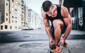 man tying his shoes