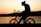 silhouette of man riding in bike