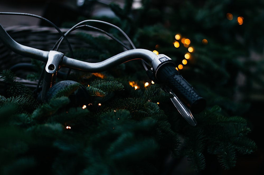 bokeh photography of gray bicycle