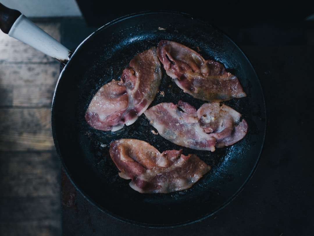 bacon on top of black cast-iron skillet, Bacon