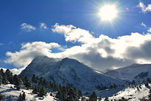 Snow-covered peaks of Sonamarg glistening in the sun.
