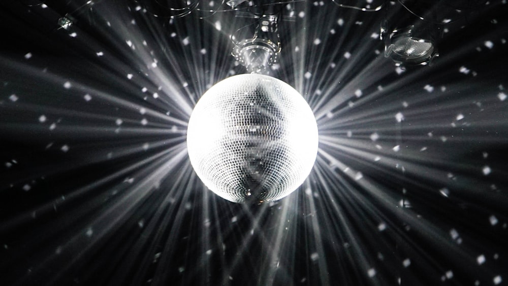 grayscale photography of disco ball