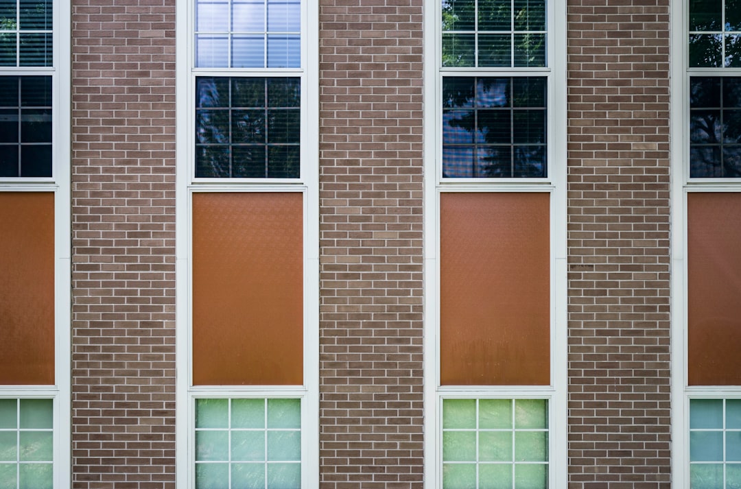 brown concrete building with closed windows