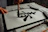 Close-up of hands creating a traditional Chinese painting with ink and brush on rice paper.