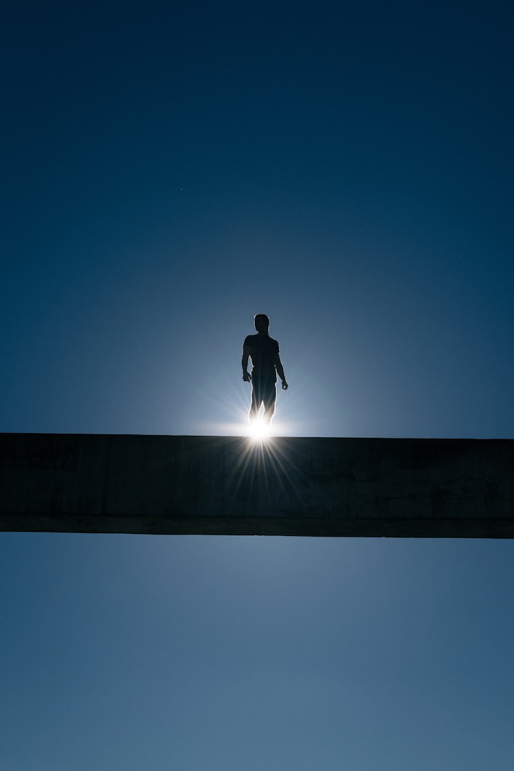 Person standing on top of an arc