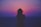 silhouette of a woman with pink and purple sky