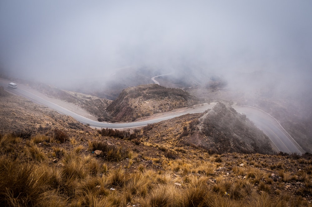 road covered in sea of clouds